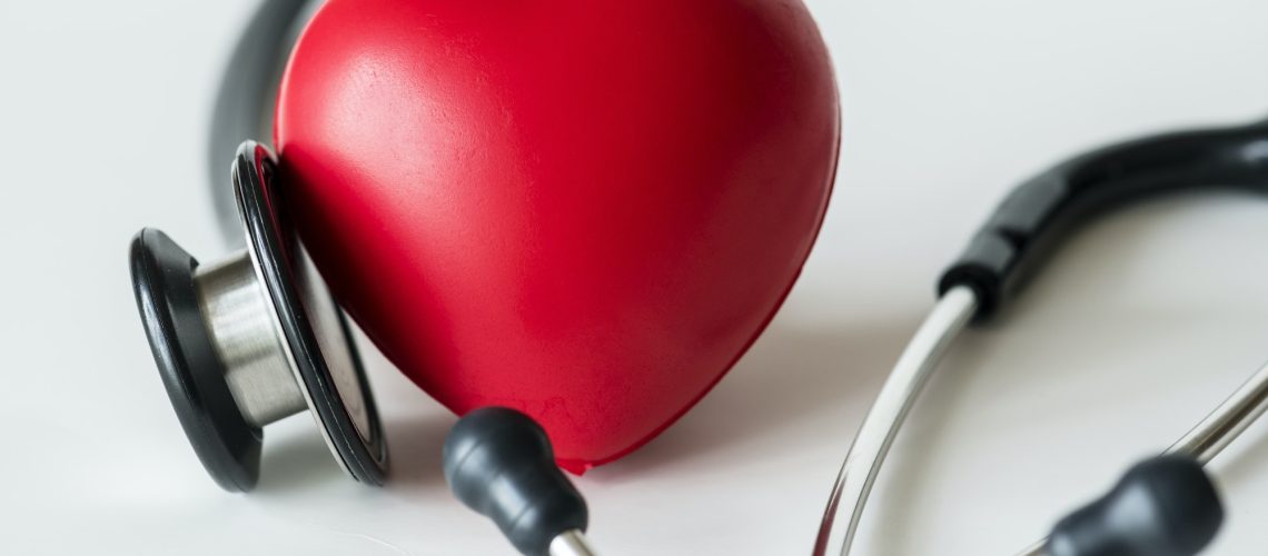 Closeup of heart and a stethoscope cardiovascular checkup concept